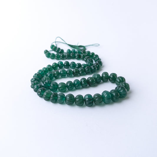 Genuine Emerald gemstone beads with carved pumpkin detailing, ideal for DIY jewellery and artisan beadwork.