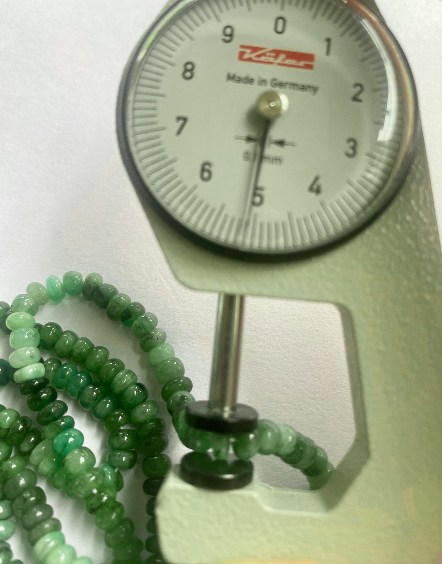 High-quality emerald beads with a glossy surface and consistent shape, perfect for elegant designs.
