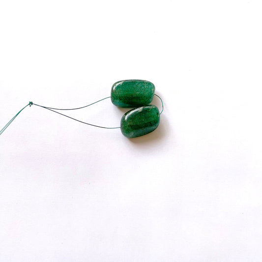 Natural emerald beads measuring 77 carats, expertly polished and artistically tumbled.