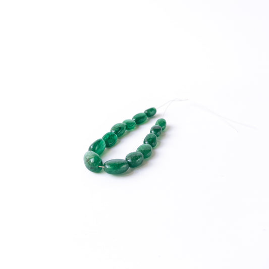 High‑quality Emerald gemstone beads with natural shine, organic form and premium green colour.