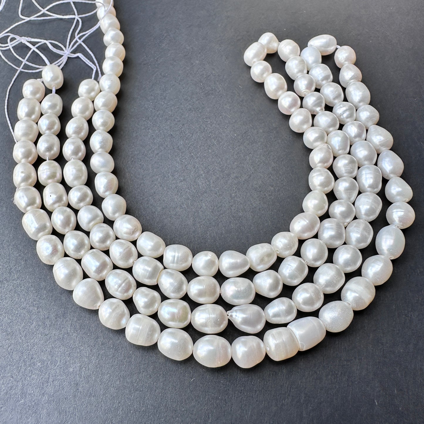Freshwater pearls with glossy finish and 0.5mm bead holes, perfect for handmade jewellery components and bridal designs.