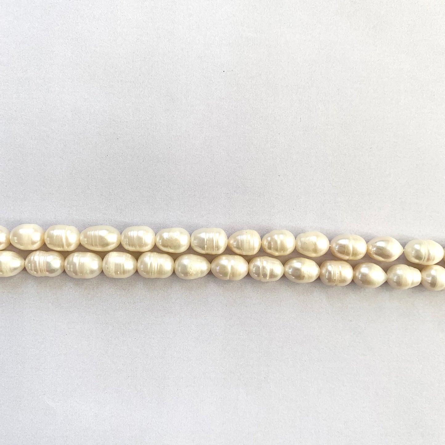 A dial gauge measures the Freshwater Pearl Baroque cut 10 x 7.7mm to 12.5 x 8.0mm gemstone.