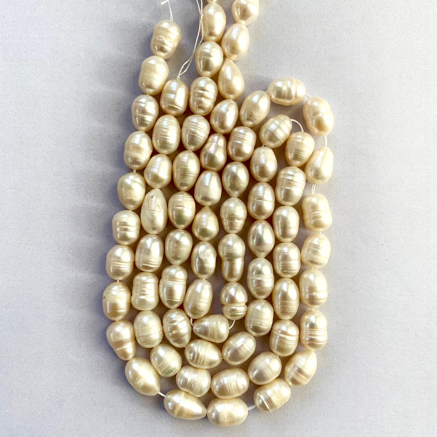 Natural lustre and irregular cuts of Baroque pearls strung together for artistic jewellery designs.