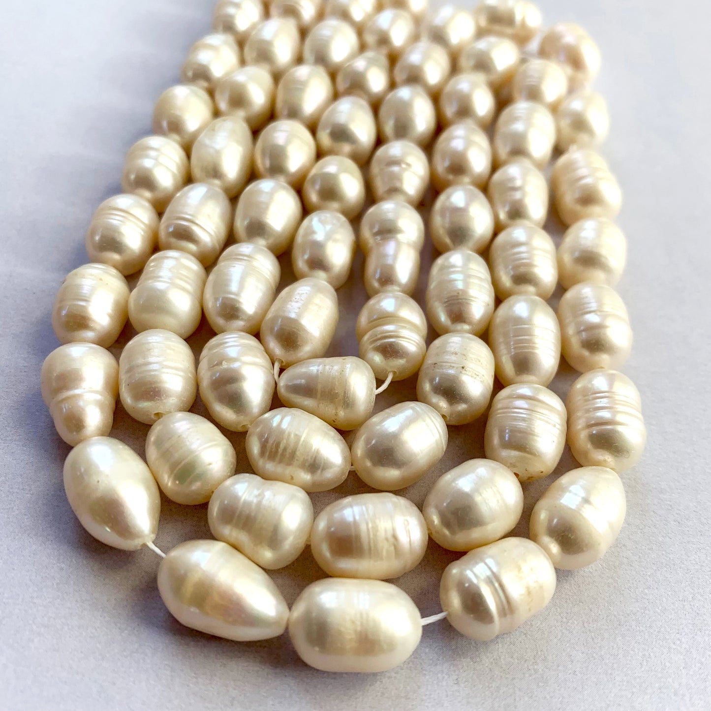 Assorted pearl shapes from 10 x 7.7mm to 12.5 x 8.0mm, ideal for bespoke jewellery styling.
