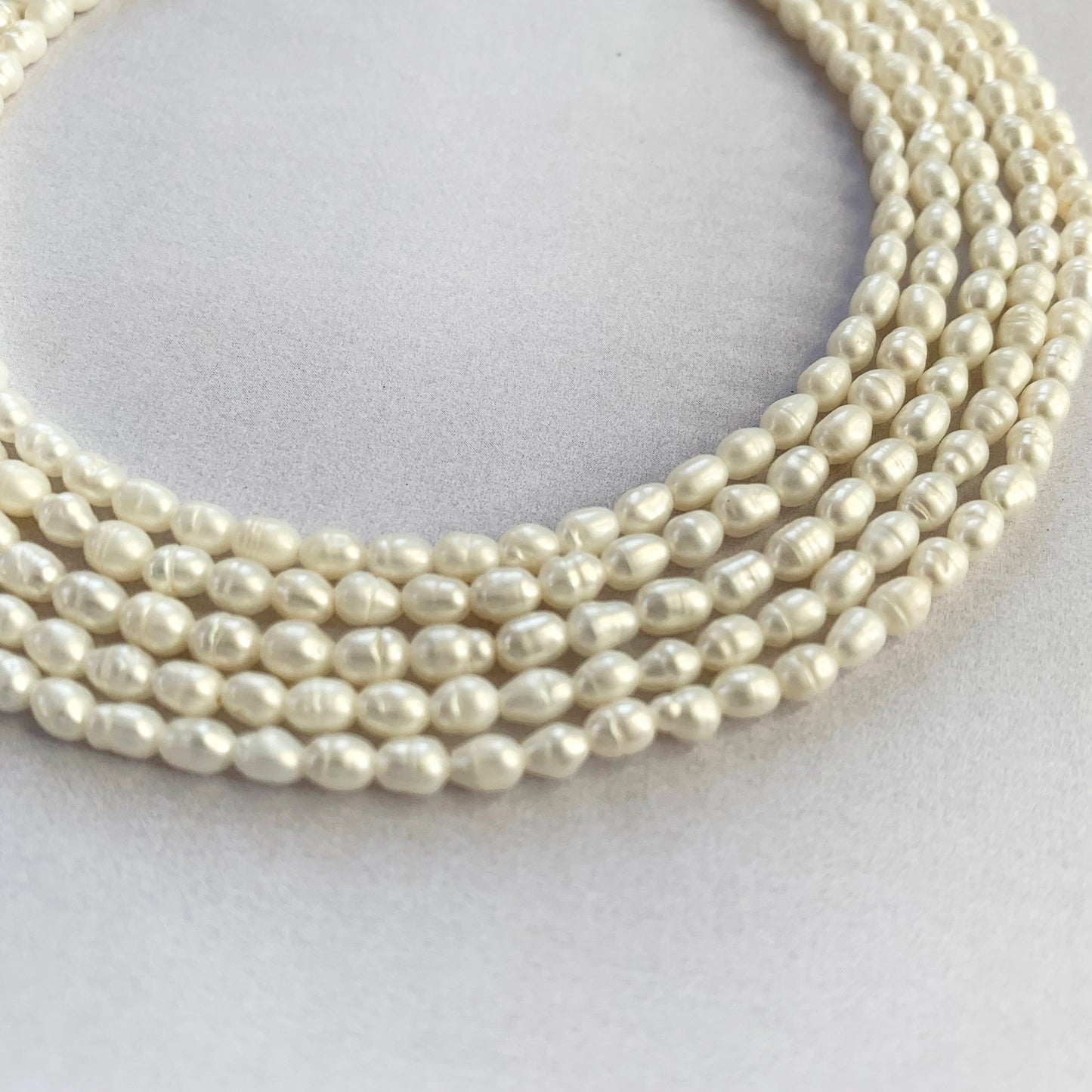 Freshwater pearls with 0.4mm holes strung seamlessly, ideal for elegant accessories.