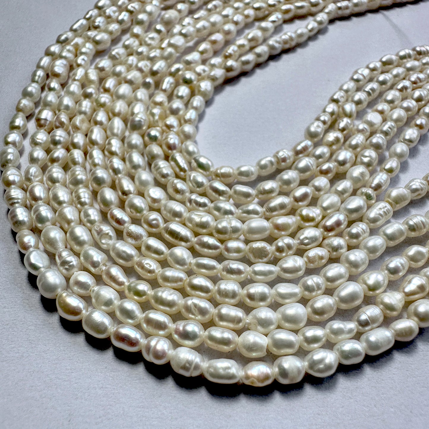 Glossy 3mm Freshwater Pearls with rice shape and 0.4mm drill holes, perfect for delicate threading.