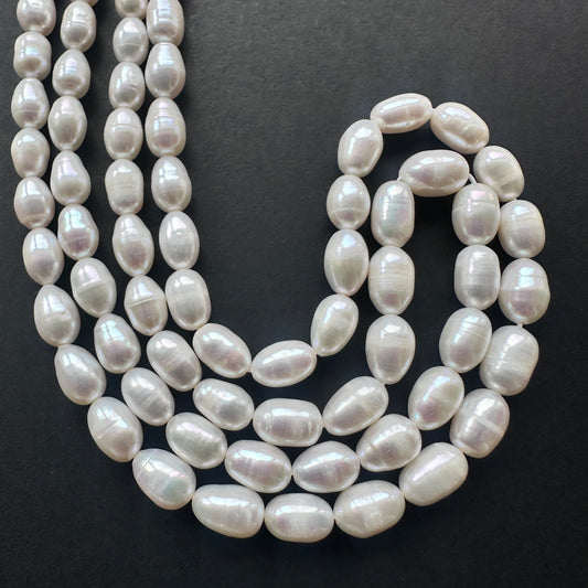 Stone beads with smooth Freshwater Pearls arranged neatly, ideal for handmade jewellery components.