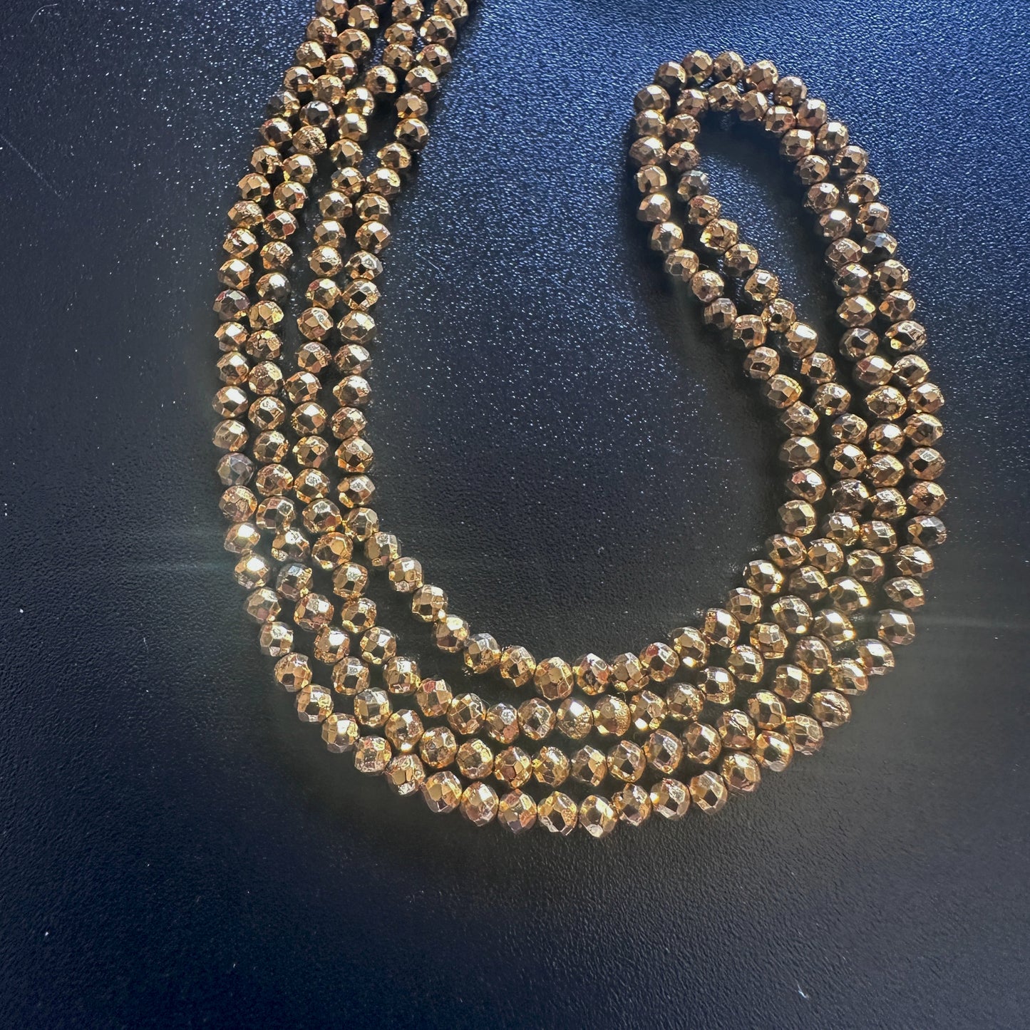 Gold pyrite beads with 0.3mm holes, ideal for fine jewellery threading and detail work.