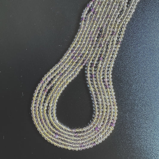 Golden Rutile beads with precision faceting and warm golden tones.