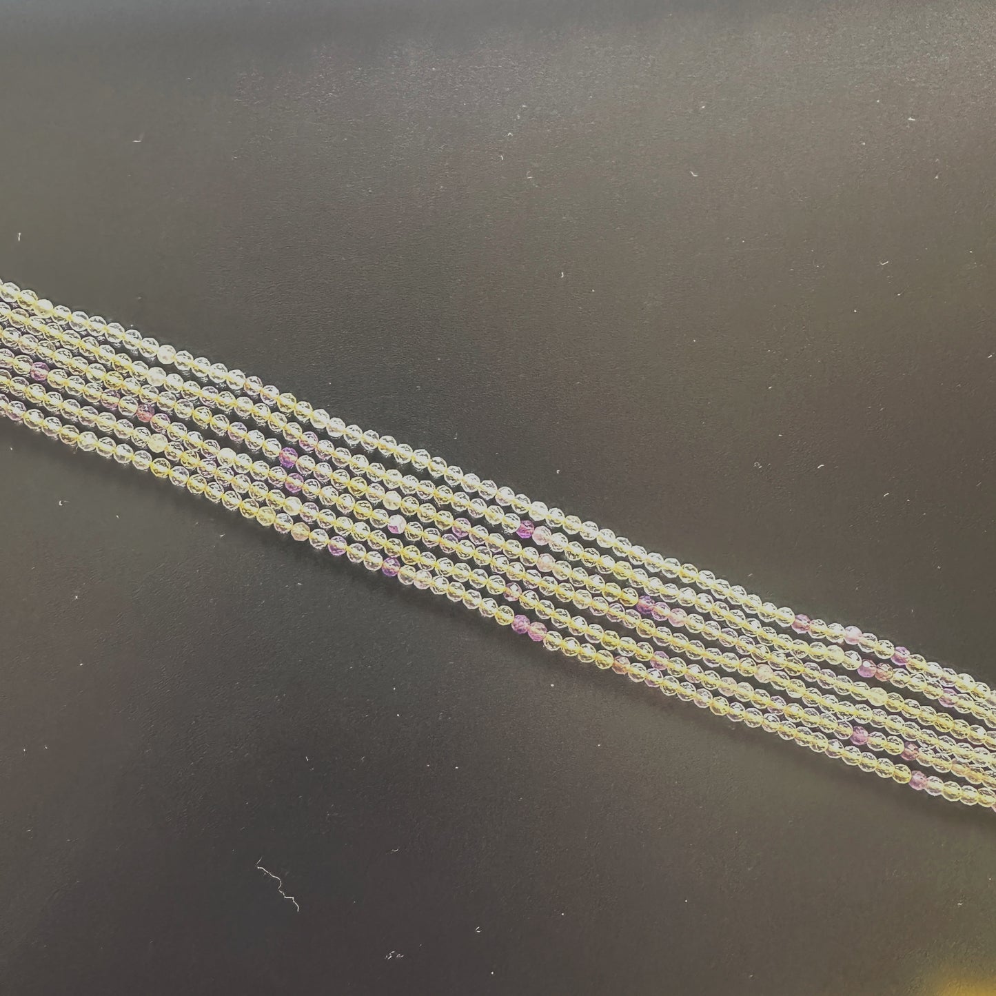 High-quality Golden Rutile rondelles with 0.4mm bead holes and polished finish.