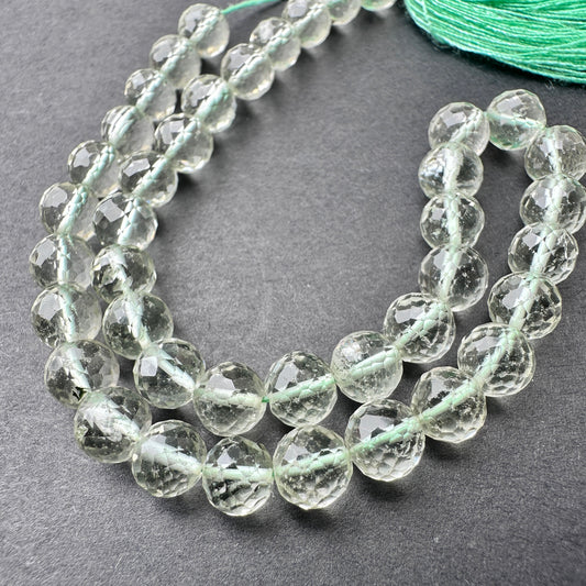 Close-up of Green Amethyst stone beads showing faceted cut and natural gemstone sparkle.