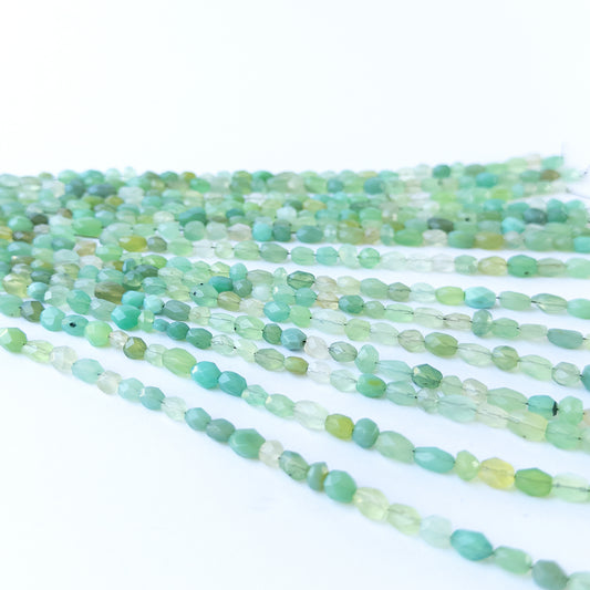Authentic Green Chalcedony gemstone beads displaying polished facets and natural green colour.