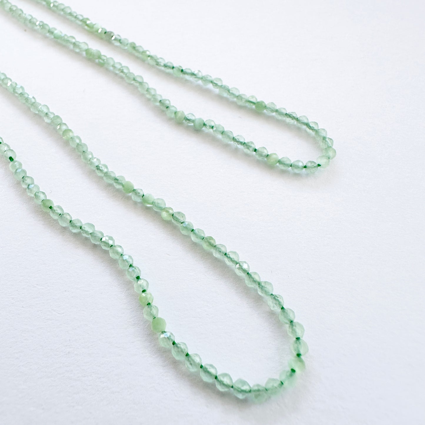 Handmade jewellery components featuring 2.1-2.2mm Green Chalcedony stone beads.