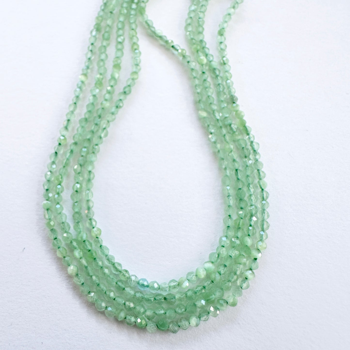 Natural gemstone beads in Green Chalcedony, arranged on a 37cm strand with consistent cut.