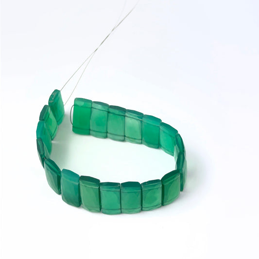 Faceted rectangle Green Onyx stone beads arranged neatly, highlighting their polished finish and handmade jewellery component quality.