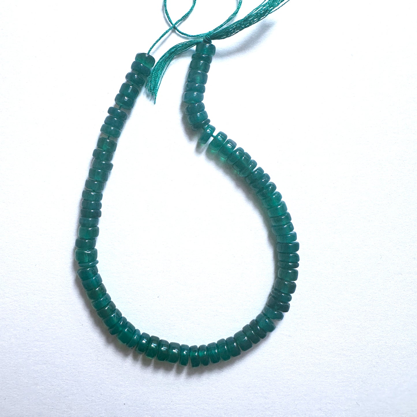 Stone beads in rich green tones with 0.5mm holes, perfect for threading into custom jewellery and fashion accessories.