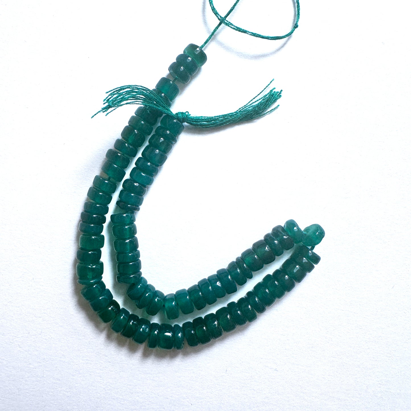 Natural gemstone beads for DIY jewellery featuring 6mm Green Onyx wheels with polished finish and elegant shape.