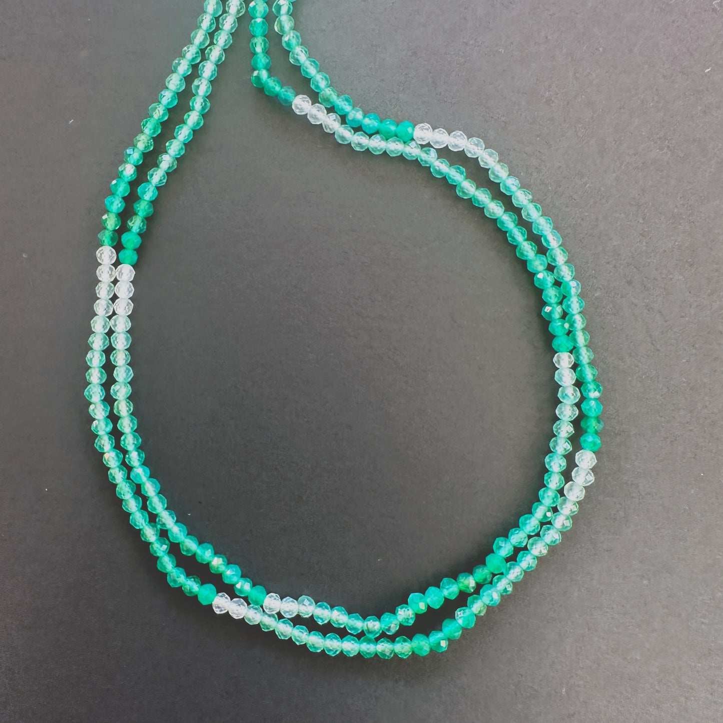 Natural gemstone beads in Green Shaded Onyx, arranged on a 32cm strand with consistent cut.