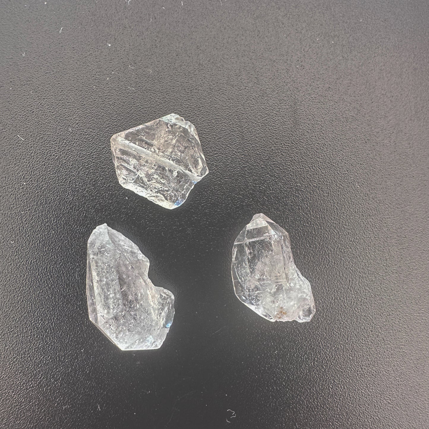 Three-piece Herkimer diamond set with high transparency and unique crystal shapes.