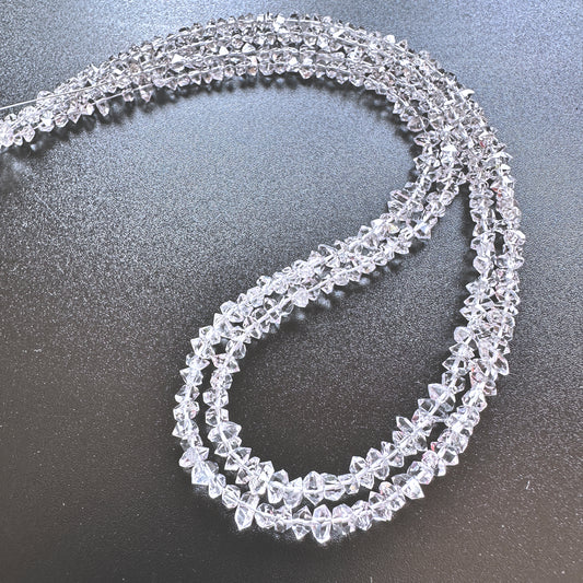 Australian gemstone bead supplier showcasing Herkimer Diamond beads with varied size and raw brilliance.