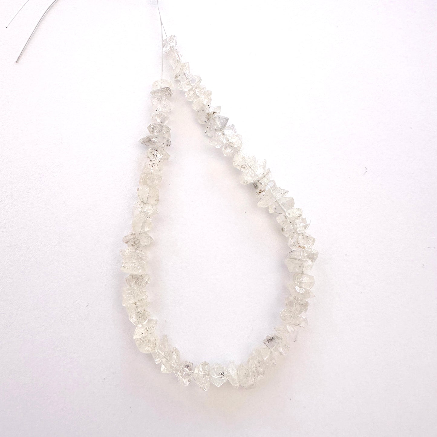 Raw Herkimer quartz beads with organic shape and clean drill holes for secure stringing.