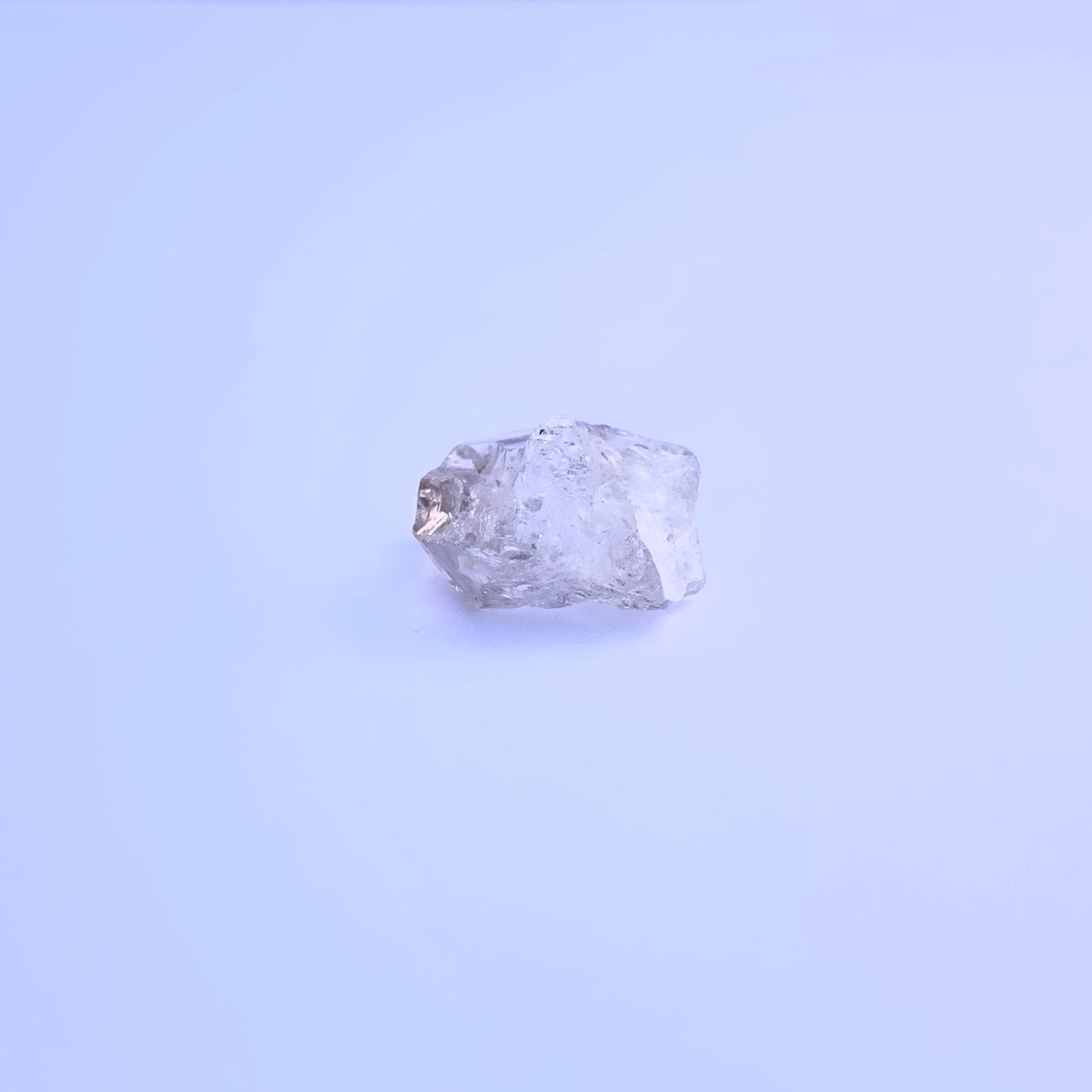 Natural Herkimer Diamond stone with uncut facets and earthy character.