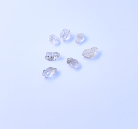 Natural gemstone beads for DIY jewellery showcasing undrilled Herkimer Diamond in rough cut.