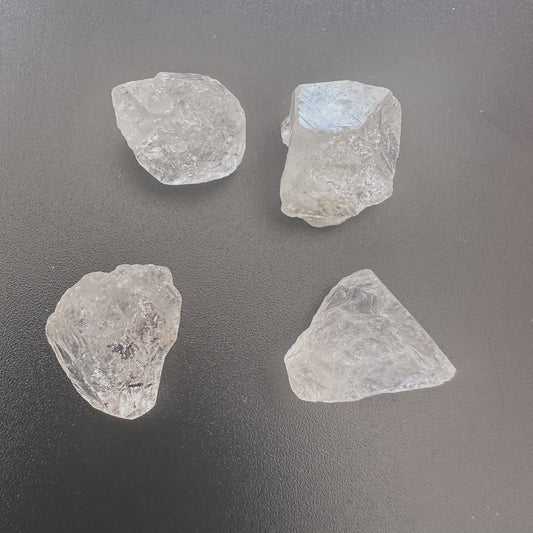 Undrilled Herkimer diamond nuggets with raw clarity and 14-16mm size displayed on a neutral background.