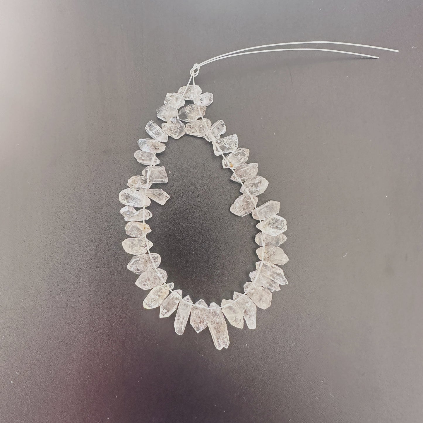 Strand of 39 Herkimer gemstones with 4–5mm size and sparkling raw finish.