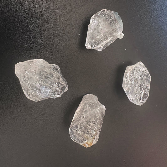 Close-up of undrilled Herkimer crystals showing double-terminated facets and high transparency.