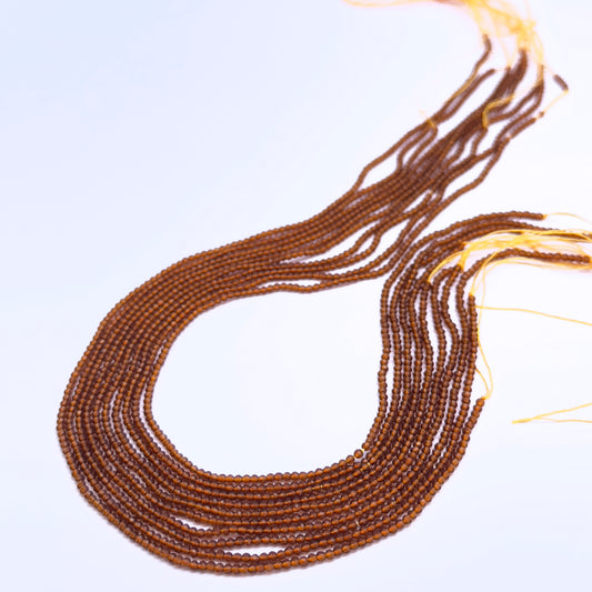 Hessonite gemstone beads for DIY jewellery displayed with soft lighting and clarity.