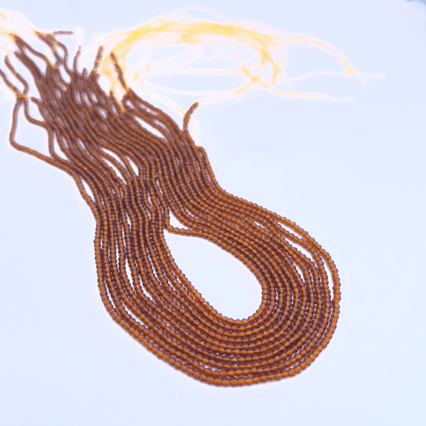 Handmade jewellery components featuring Hessonite faceted rondelle beads.
