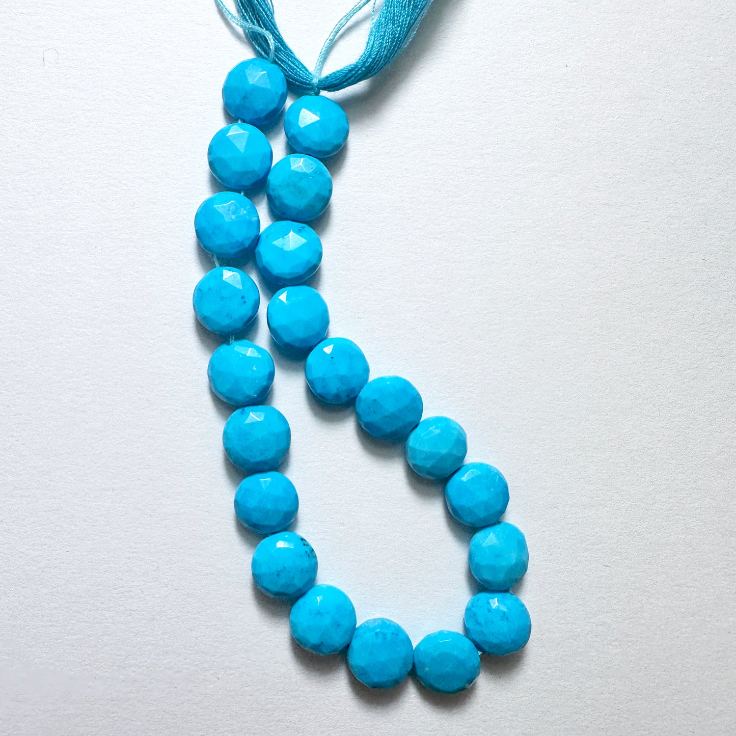 Stone beads in turquoise tones with 0.5mm holes, perfect for threading in custom jewellery and fashion accessories.