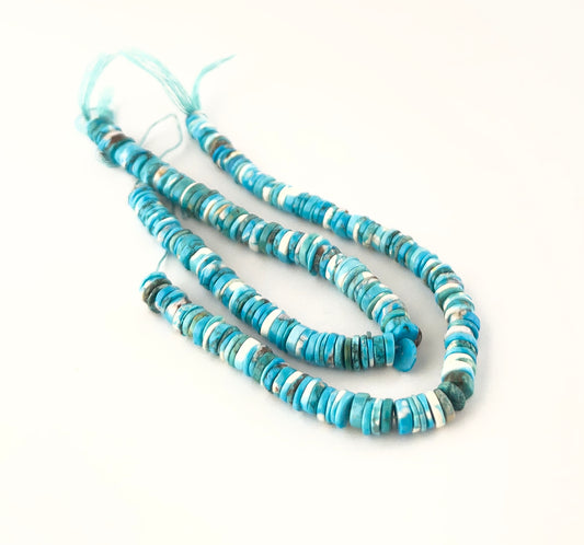 Howlite Turquoise smooth wheel heishi gemstones with clean rounded shaping and vibrant blue tones across a 20cm strand.