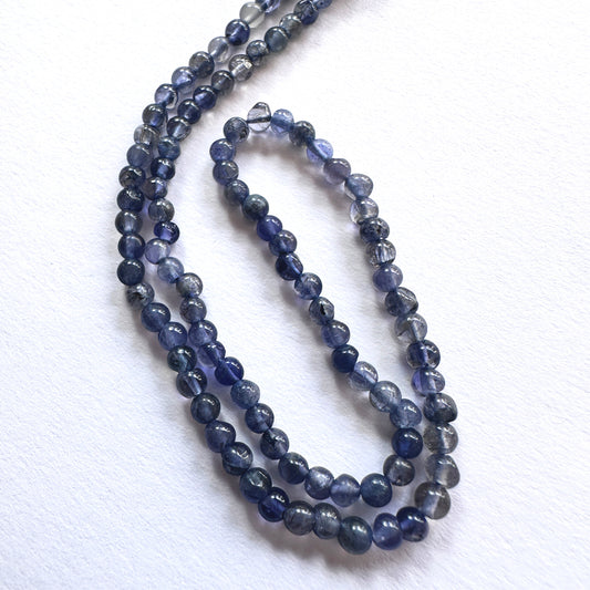 Natural gemstone beads featuring Iolite with consistent cut and subtle shimmer, ideal for DIY jewellery projects.