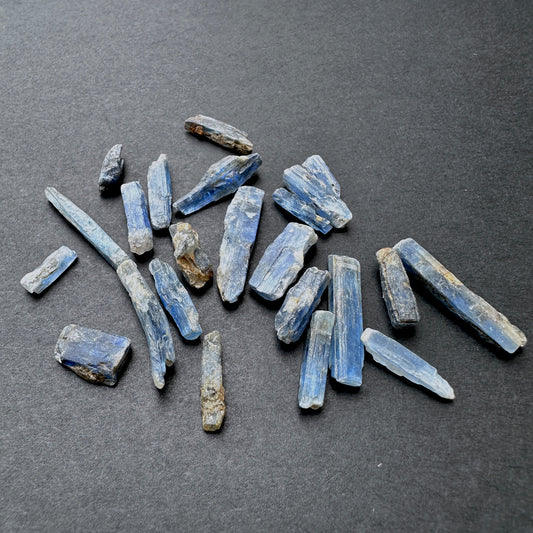 Close‑up of Kyanite rough stones showing raw texture and natural inclusions.