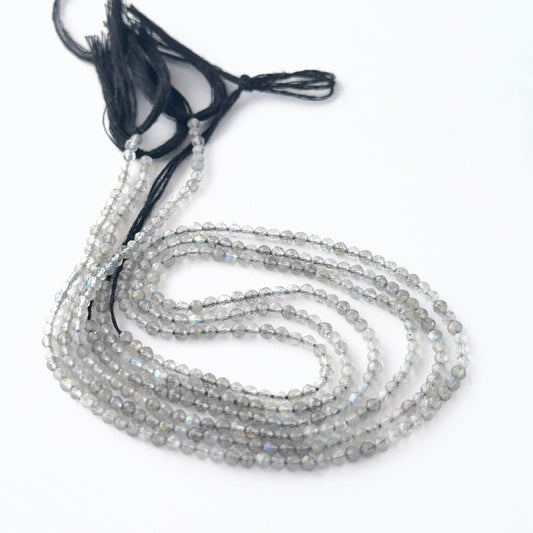 Labradorite rondelle beads with natural shimmer and fine faceting for creative jewellery designs.