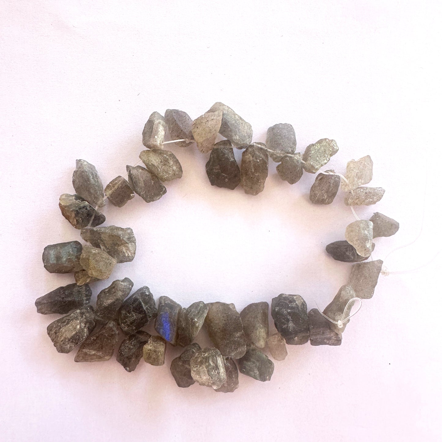 Labradorite rough stones with 0.5mm bead holes, ideal for sturdy stringing and bold designs.