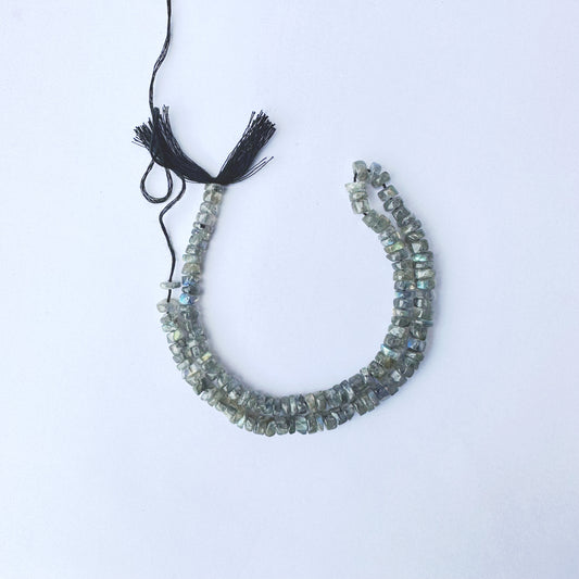 Smooth Labradorite wheel beads with 5.5mm size and polished finish on a 34cm strand.