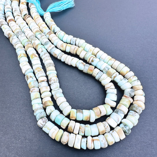 Natural gemstone beads in Larimar, arranged on a 33cm strand with consistent wheel cut.