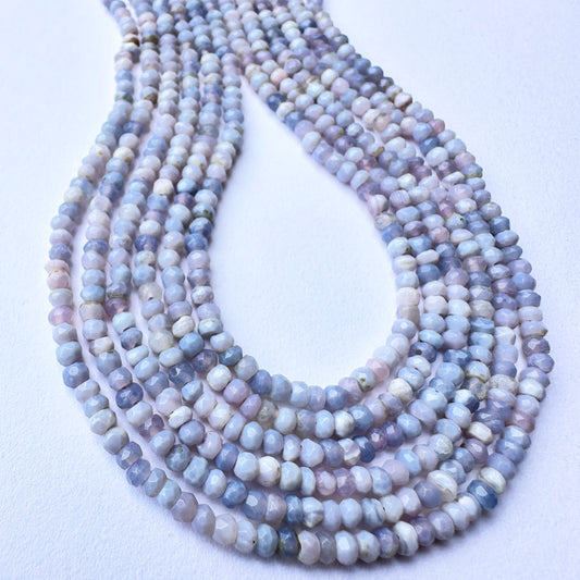Close-up of stone beads arranged on a 32cm strand showcasing sparkle, colour clarity, and craftsmanship.