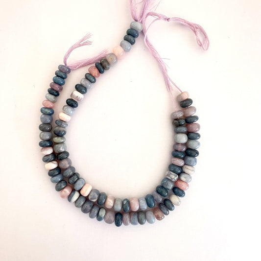 Lavender Opal rondelle beads set in a neat loop showcasing consistent size and cut.