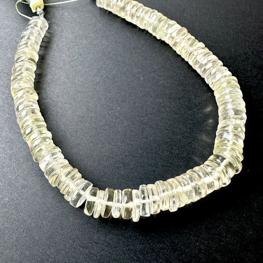 Stone beads with smooth Lemon Quartz arranged neatly, ideal for handmade jewellery components.