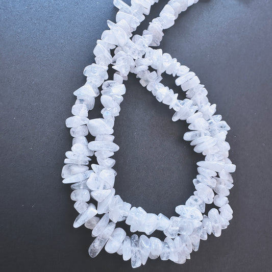 Stone beads with Moonstone chips arranged neatly, ideal for handmade jewellery components.