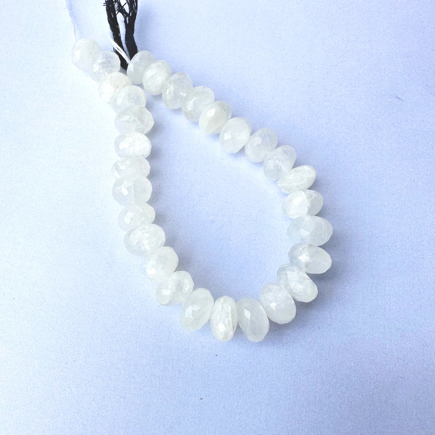 Moonstone rondelle beads with 10-10.5mm size and faceted cut on a 19cm strand.