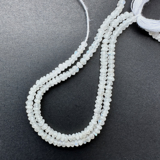 Close-up of Moonstone stone beads showing faceted cut and natural gemstone shimmer.