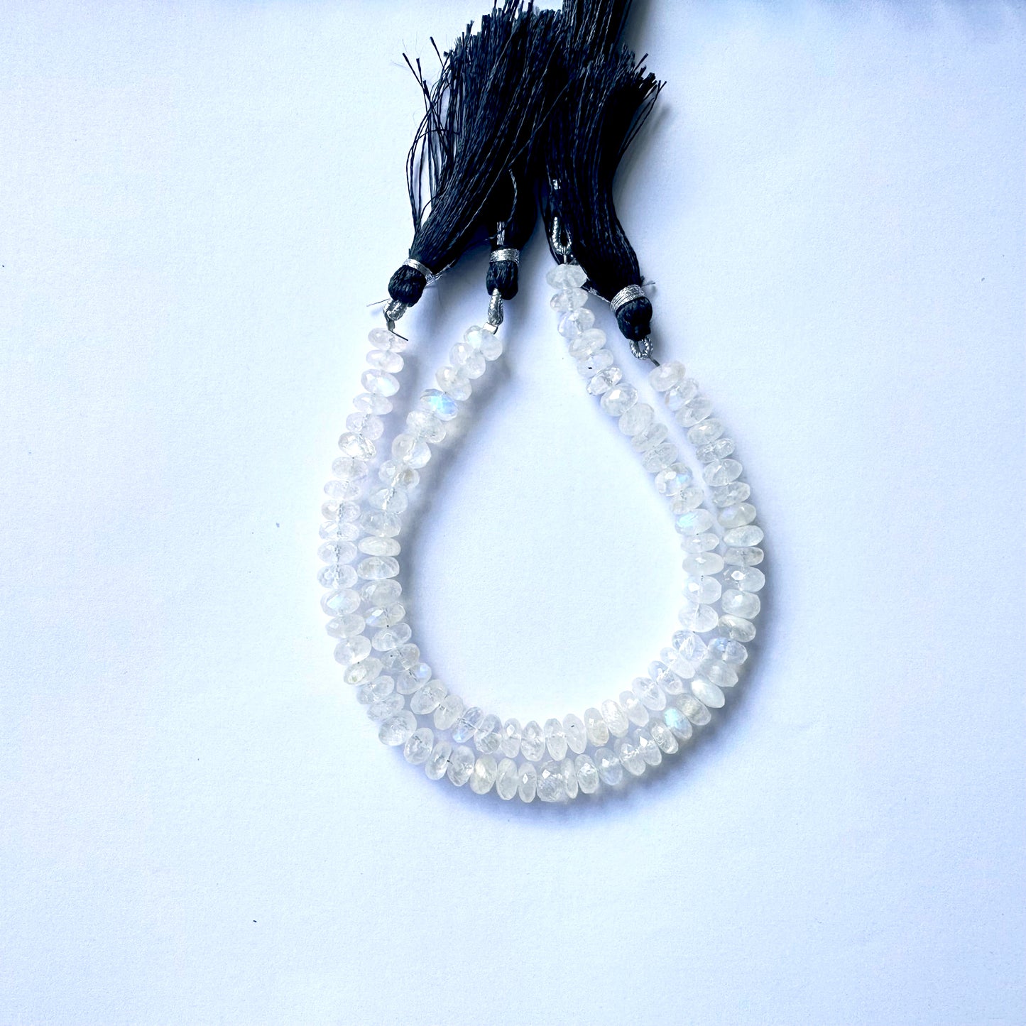 Moonstone faceted rondelle beads with shimmering cut and pastel hue on a 20cm strand.