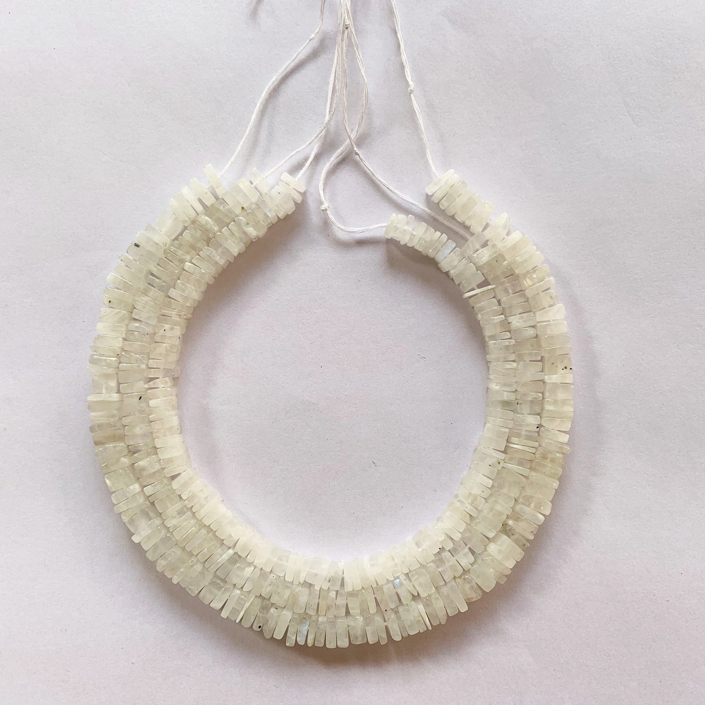 Moonstone heishi square beads in soft white tones, strung on a 20cm or 24cm strand.