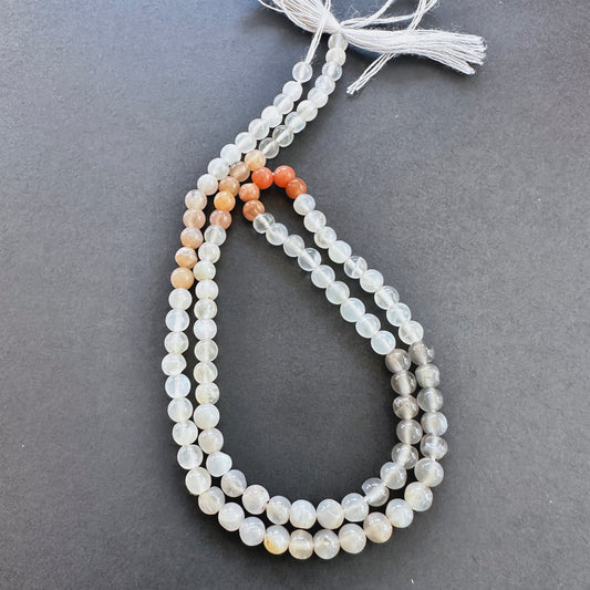 Natural gemstone beads in Moonstone, arranged on a 33cm strand with consistent polish.