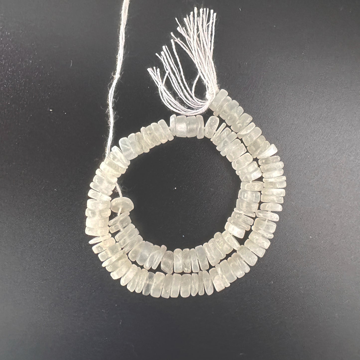 Moonstone smooth wheel beads with 6mm size and glowing opalescent finish.